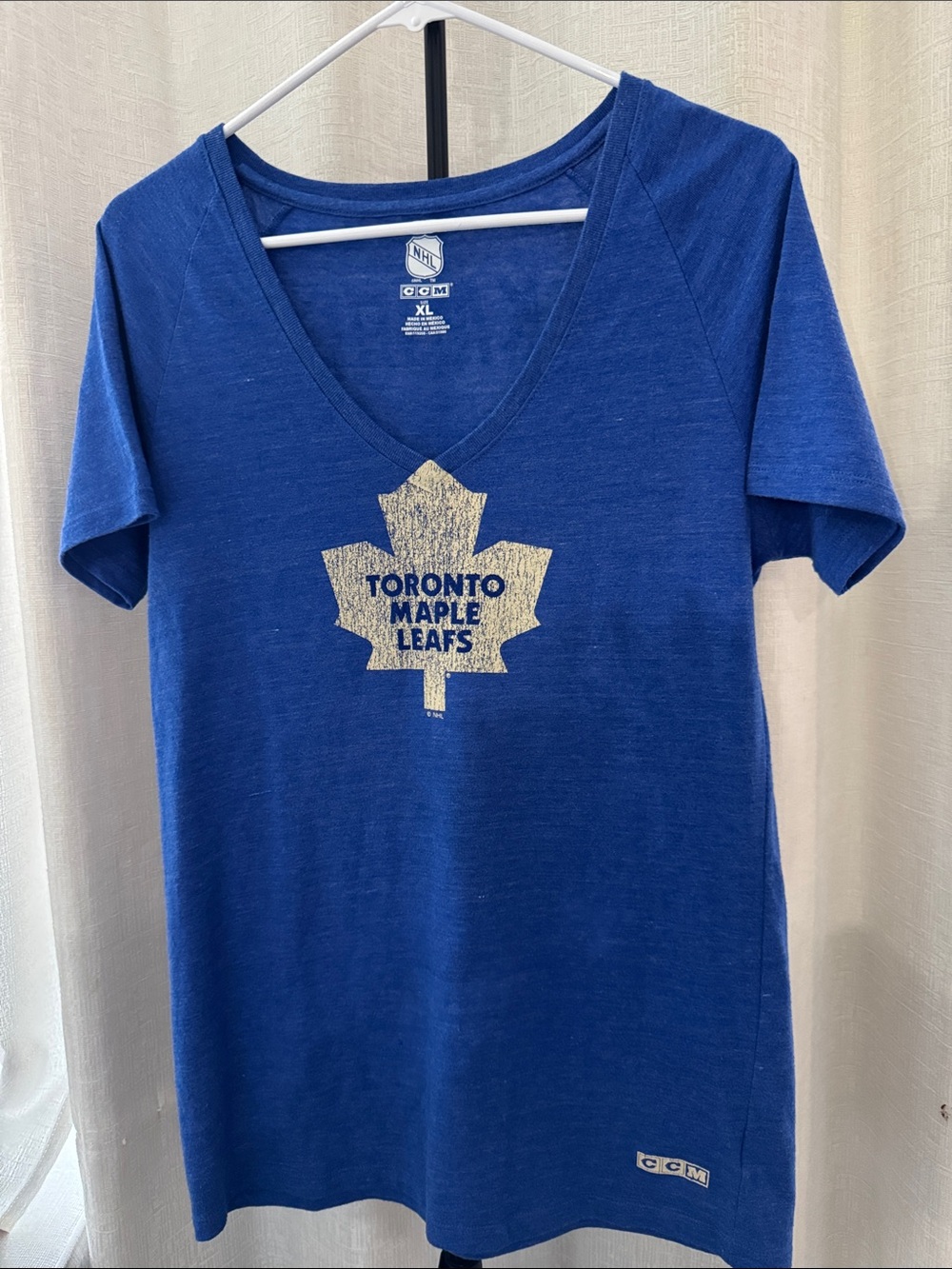 CCM Women's Royal Blue V-Neck Tee with Gold Maple Leaf Graphic